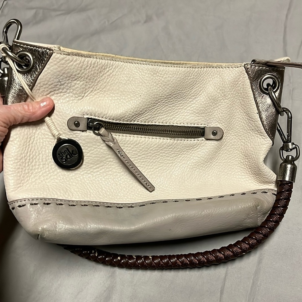 Sak medium purse. Well loved. cream and beige with brown rope handle
